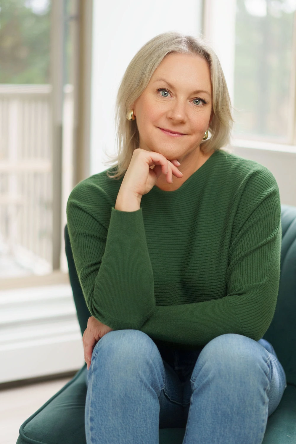 east vancouver counsellor kerry anne holloway wearing a green sweater smiling at the camera