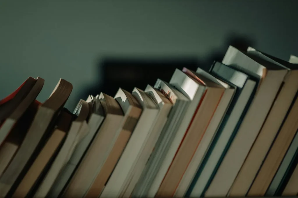 row of mental health books in dimly lit room